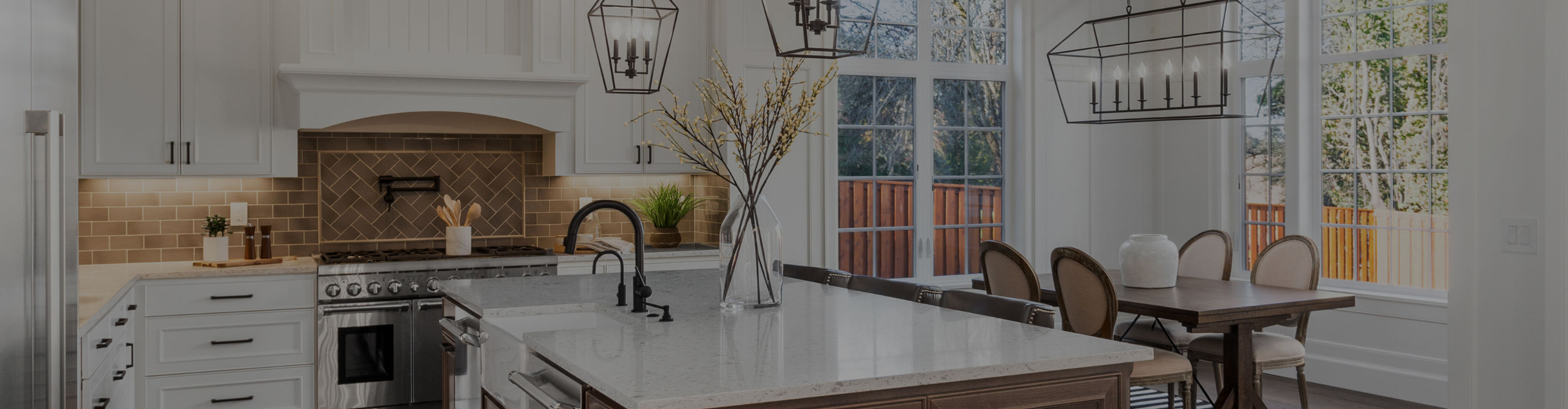 Fancy modern kitchen with white countertops.